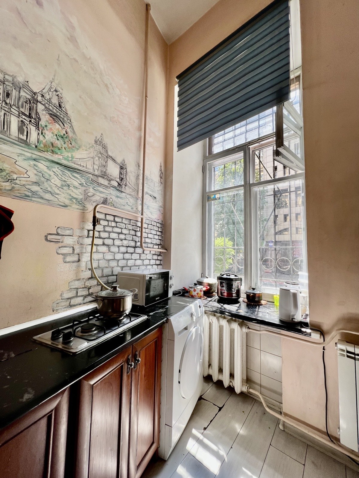 Dja Hostel kitchen — stove and window