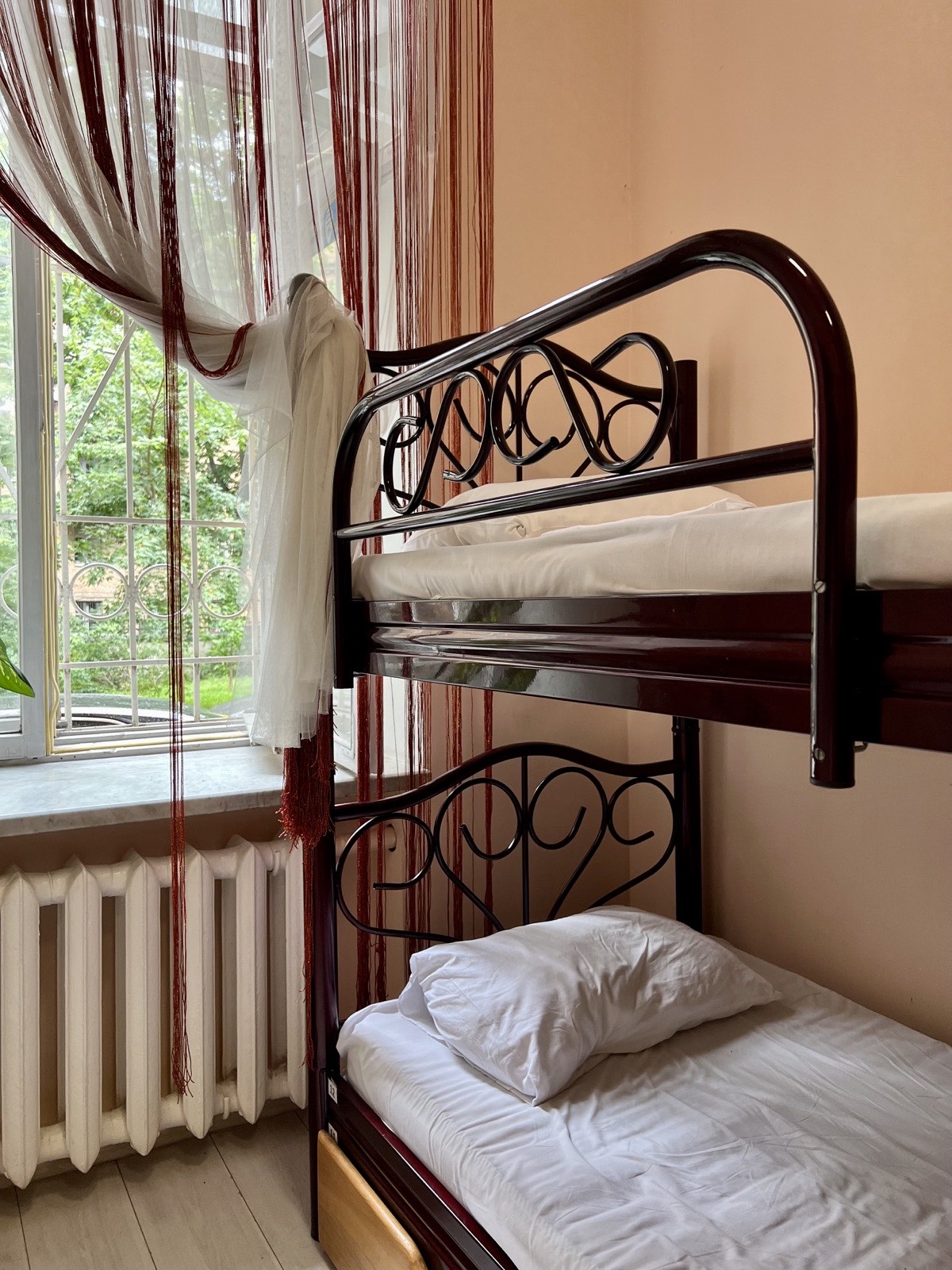 Women's room #1 — bed by window